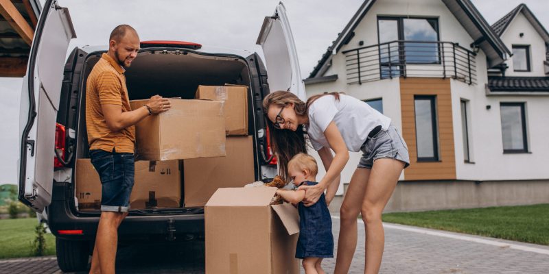 young-family-with-little-daughter-moving-into-new-house-scaled-1.jpg